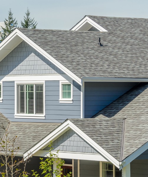 Arial view of commercial building with new ashpalt roof installed by McGregor Roofing